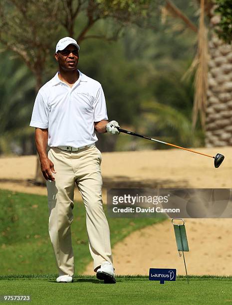 Marcus Allen lines up his tee shot during the Laureus World Sports Awards Golf Challenge at the Abu Dhabi Golf Club on March 9, 2010 in Abu Dhabi,...