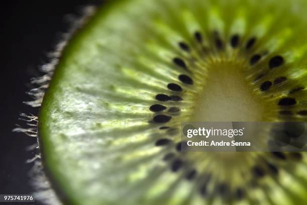 kiwi fluorescente - fluorescente stock pictures, royalty-free photos & images