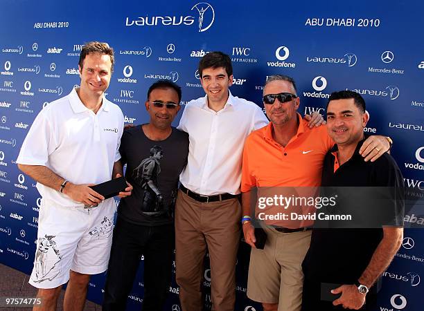 Ian Botham and Michael Vaughan pose after winning the Laureus World Sports Awards Golf Challenge at the Abu Dhabi Golf Club on March 9, 2010 in Abu...