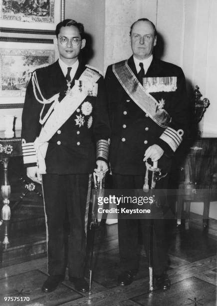 King Bhumibol of Thailand poses with King Olav V of Norway at the Royal Palace in Oslo, during a state visit to Norway, 19th September 1960.