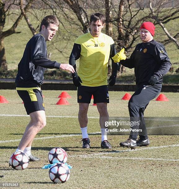 Michael Carrick, Gary Neville and Wayne Rooney of Manchester United in action during a First Team Training Session at Carrington Training Ground on...
