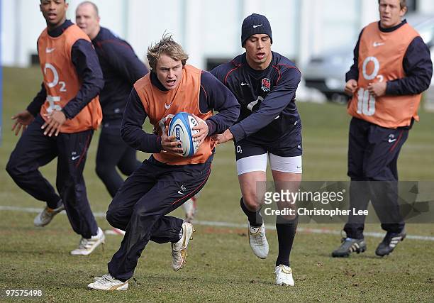 Matthew Tait in action against Courtney Lawes during the England Training Session and Press Conference at Pennyhill Park on March 9, 2010 in Bagshot,...