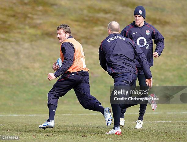 Mark Cueto races away from Mike Tindall during the England Training Session and Press Conference at Pennyhill Park on March 9, 2010 in Bagshot,...