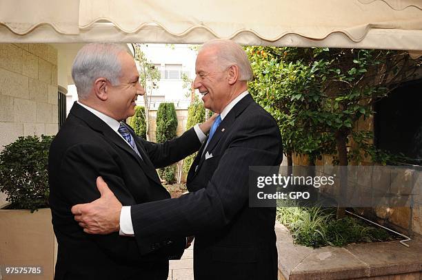 In this handout image from the Israeli Government Press Office, L - R Israeli Prime Minister Benjamin Netanyah greets US Vice President Joe Biden on...