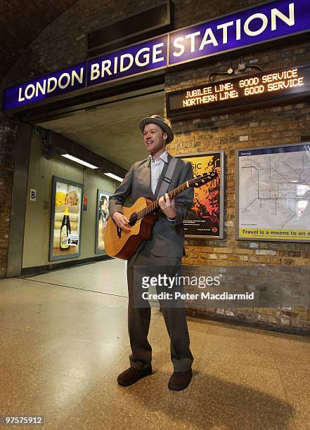 Jamie West, winner of London Underground's 2009 best busker competition, performs at London Bridge Underground Station on March 9, 2010 in London,...