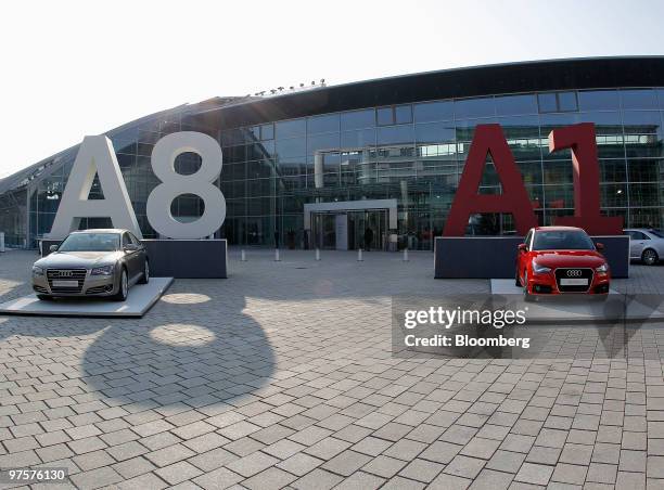 An Audi 8, left, and the Audi A1 automobile sit on display during the company's full year earnings press conference in Ingolstadt, Germany, on...