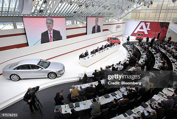 Journalists listen to Rupert Stadler, chief executive officer of Audi AG, as he speaks at the company's full year earnings press conference in...