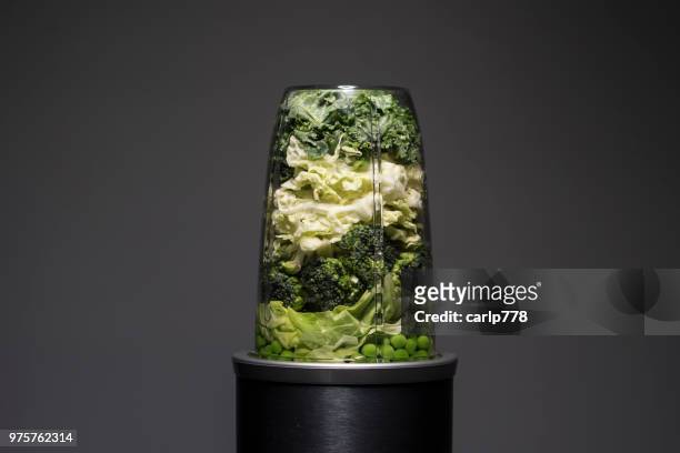 green vegetables in a blender for smoothie drink - blender foto e immagini stock