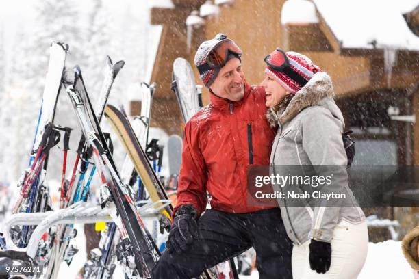 baby boomer couple embrace at sk lodge - montana winter stock pictures, royalty-free photos & images