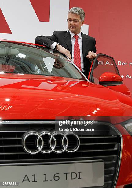 Rupert Stadler, chief executive officer of Audi AG, poses next to an Audi A1 automobile during the company's full year earnings press conference in...