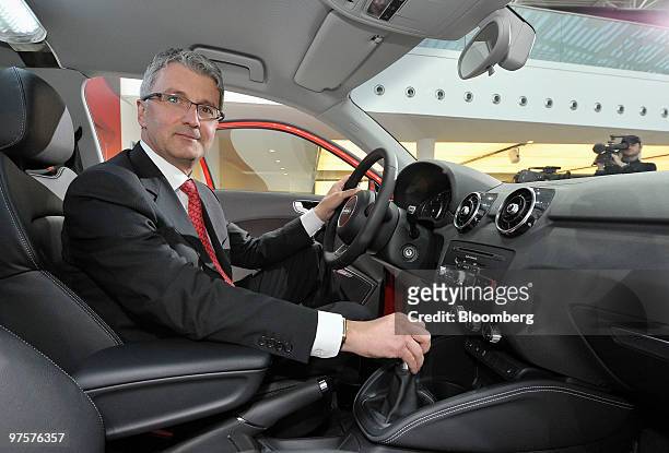Rupert Stadler, chief executive officer of Audi AG, sits in an Audi A1 automobile during the company's full year earnings press conference in...