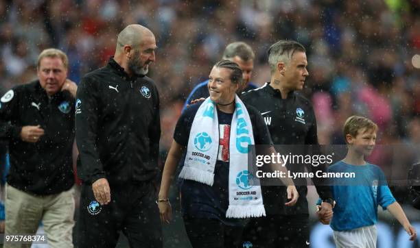 Eric Cantona and Robbie Williams with the mascots during the Soccer Aid for UNICEF 2018 match between England and The Rest of the World at Old...