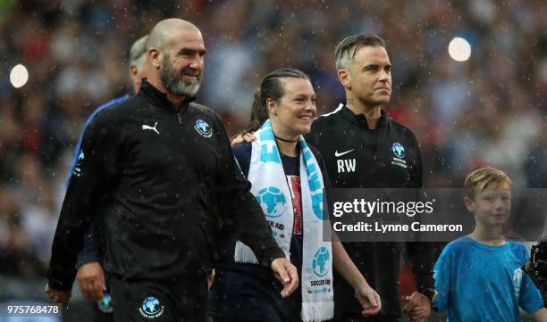 French former soccer player Eric Cantona and Robbie Williams with the mascots during the Soccer Aid for UNICEF 2018 match between England and The...