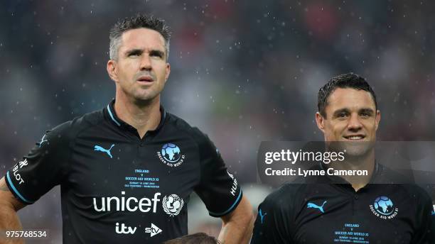 Kevin Pietersen and Dan Carter line up during the Soccer Aid for UNICEF 2018 match between England and The Rest of the World at Old Trafford on June...