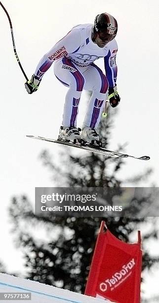 France's David Poisson jumps during the Men's Downhill at the Alpine skiing World Cup in Garmisch Partenkirchen, southern Germany on March , 2010....