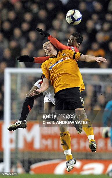 Manchester United's French defender Patrice Evra vies with Wolverhampton Wanderers' English midfielder David Jones during the English Premier League...