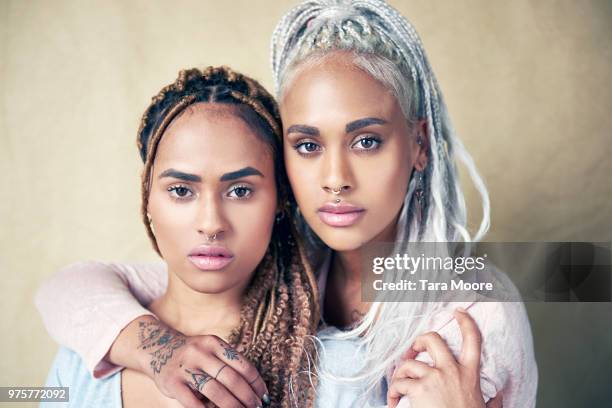 portrait of twin sisters - twins stock pictures, royalty-free photos & images