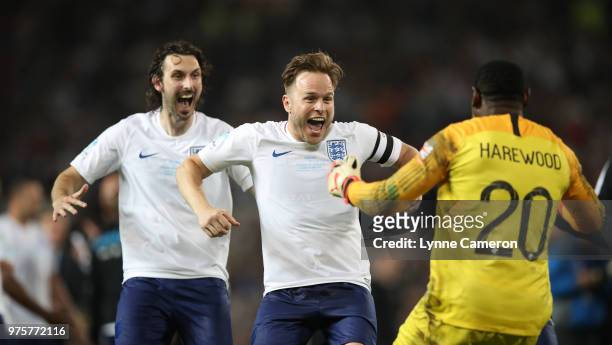 Blake Harrison and Olly Murs celebrate with David Harewood after England won the Soccer Aid for UNICEF 2018 match between England and The Rest of the...