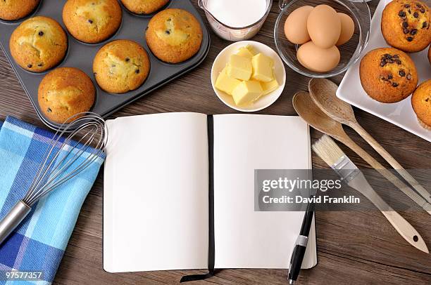 blank cookbook with fresh muffins and ingredients - muffin pan stock pictures, royalty-free photos & images