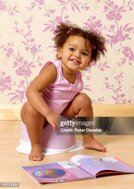 hispanic toddler potty training - child urinating stock pictures, royalty-free photos & images