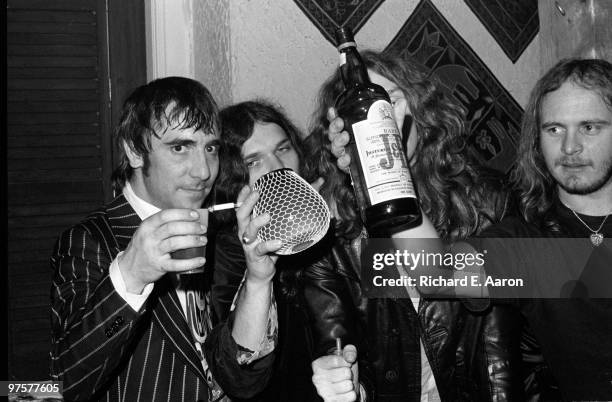 Members of Lynyrd Skynyrd posed with Keith Moon from The Who at a party for Lynyrd Skynyrd at Nathans in New York on October 23 1976 L-R Keith Moon,...