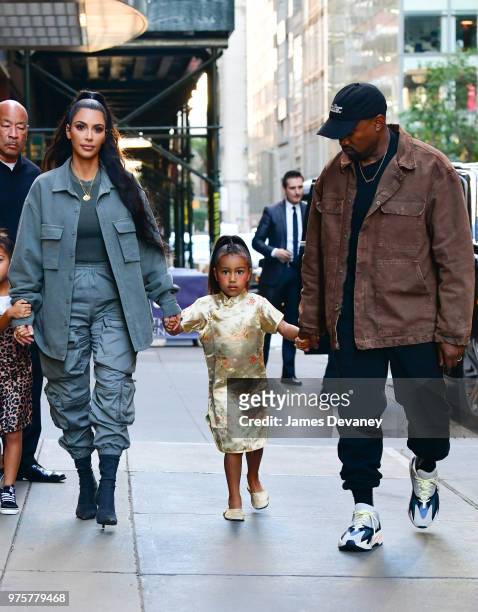 Kim Kardashian, North West and Kanye West arrive to The Polo Bar on June 15, 2018 in New York City.