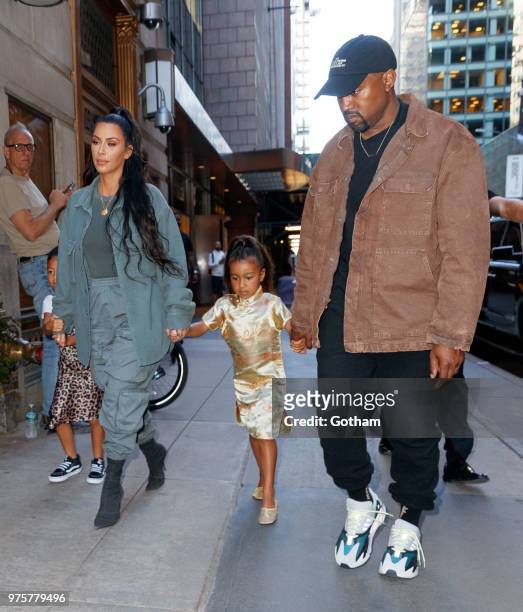 Kim Kardashian and Kanye West take North West to Polo Bar on June 15, 2018 in New York City.