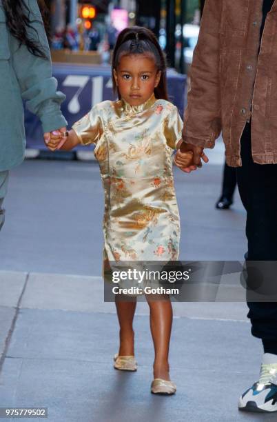 Kim Kardashian and Kanye West take North West to Polo Bar on June 15, 2018 in New York City.