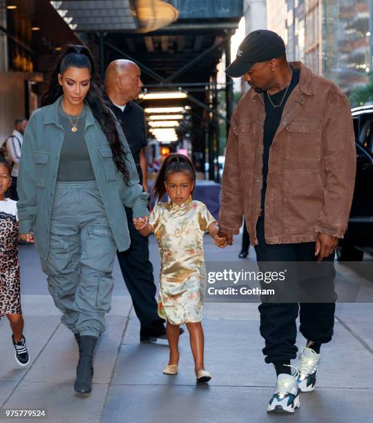 Kim Kardashian and Kanye West take North West to Polo Bar on June 15, 2018 in New York City.