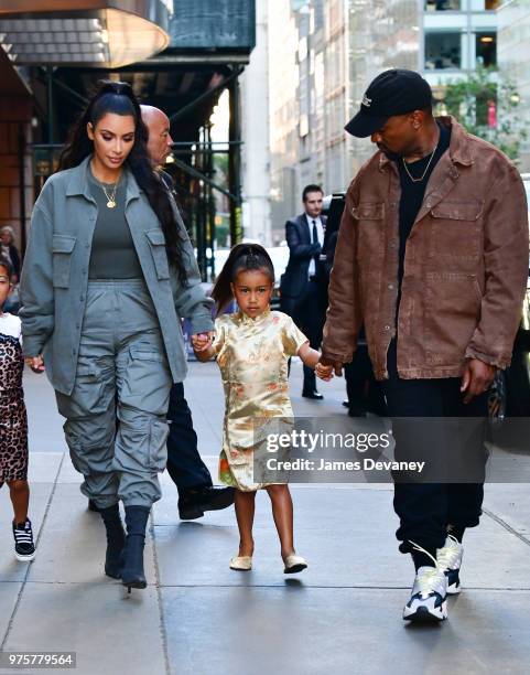 Kim Kardashian, North West and Kanye West arrive to The Polo Bar on June 15, 2018 in New York City.