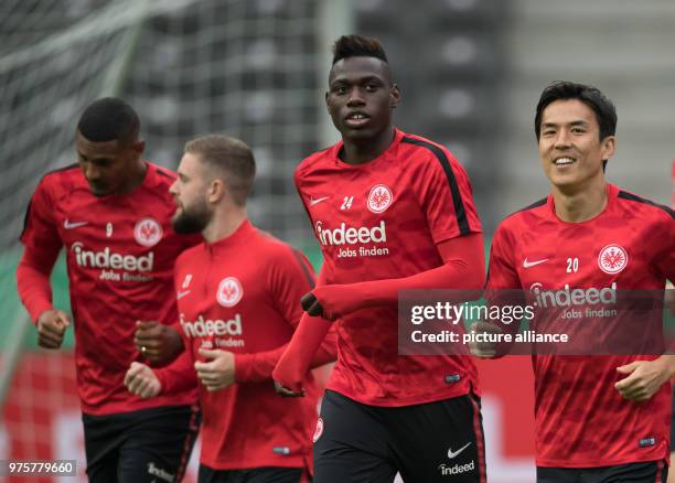 May 2018, Germany, Berlin: Sebastien Haller , Marc Stendera, Danny da Costa and Makoto Hasebe of Eintracht Frankfurt pictured during a training...