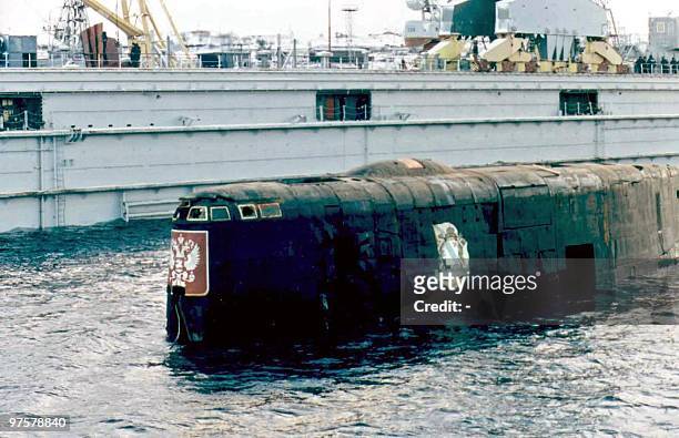The conning tower of the Kursk nuclear submarine appears at the surface in the port of Roslyakovo, near Murmansk, 23 October 2001. The Kursk nuclear...