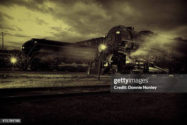 the race - train yard at night stock pictures, royalty-free photos & images