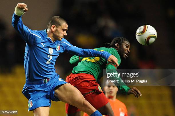 Leonardo Bonucci of Italy and Dorge Kouemaha of Cameroon compete for a header during the International Friendly match between Italy and Cameroon at...