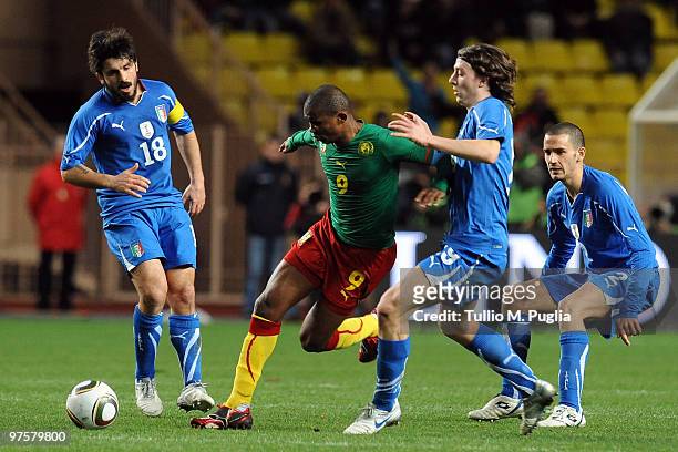 Samuel Eto'o of Cameroon is Challenged by Riccardo Montolivo of Italy as Gennaro Gattuso and Leonardo Bonucci look on during the International...