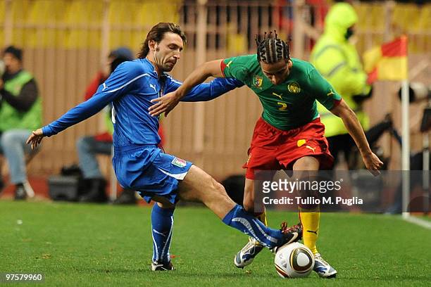 Benoit Assou Ekotto of Cameroon is challenged by Andrea Pirlo of Italy during the International Friendly match between Italy and Cameroon at Louis II...