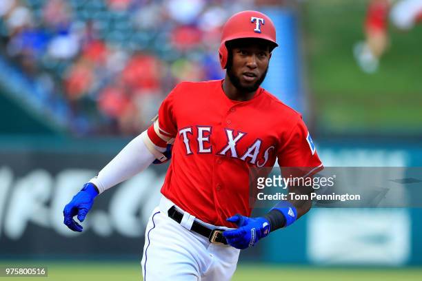 Jurickson Profar of the Texas Rangers rounds the bases after hitting a two-run home run against the Colorado Rockies in the bottom of the first...