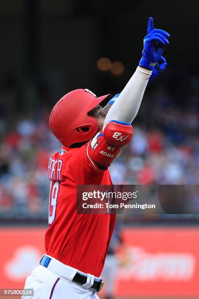 Jurickson Profar of the Texas Rangers rounds the bases after hitting a two-run home run against the Colorado Rockies in the bottom of the first...