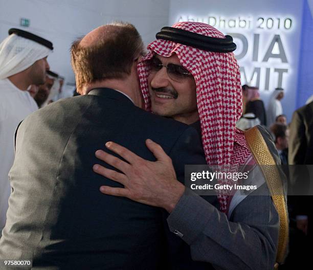 Media mogul Rupert Murdoch is embraced by Saudi billionaire Prince Al Waleed bin Talal at the inaugural Abu Dhabi Media Summit, on March 09, 2010 in...