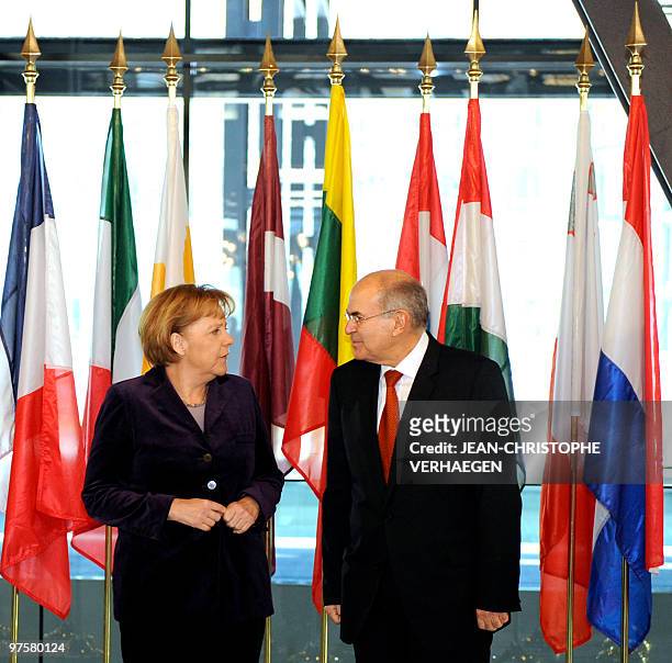 German chancellor Angela Merkel speaks with the president of the Court of Justice Vassilios Skouris at the Court of Justice of the European Union, on...