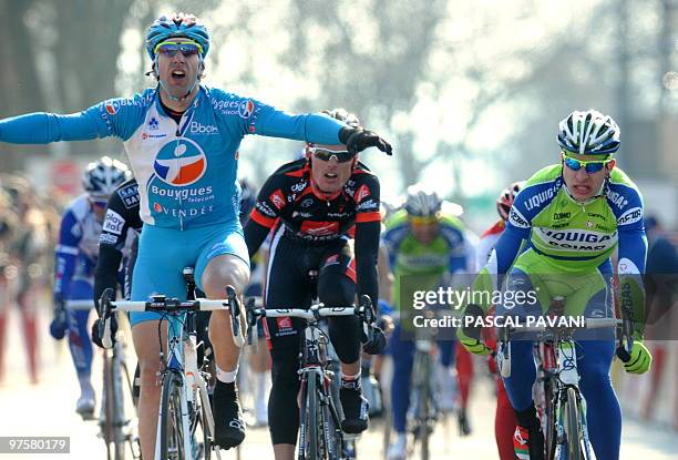 France's BBOX Bouygues Telecom cycling race's France's William Bonnet celebrates on the finish line with Spanish cycling team Caisse d'Epargne,...