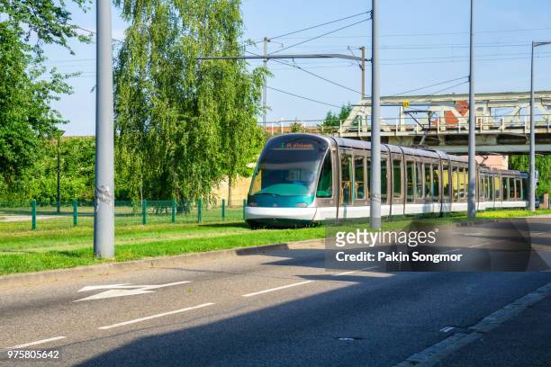 modern tram on railway in strasbourg, france - strasbourg eu stock pictures, royalty-free photos & images