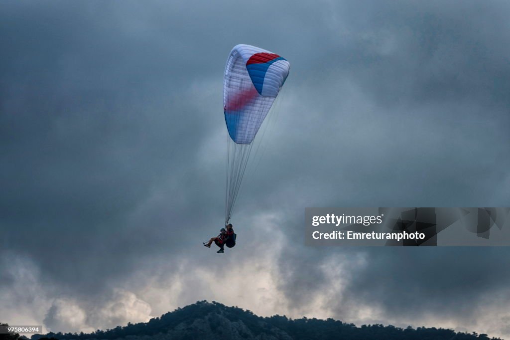 Para glider coming down on an overcast day at Ölüdeniz,Fethiye.