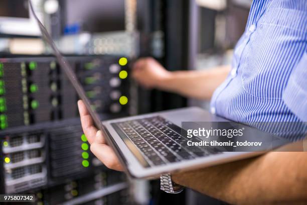 engineer in the server room close-up - repairing stock pictures, royalty-free photos & images