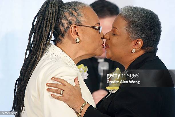 Darlene Garner and Candy Holmes , both are reverends of Metropolitan Community Churches, exchange kisses during their wedding ceremony on the first...