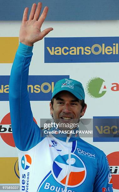 France's BBOX Bouygues Telecom cycling race's France's William Bonnet celebrates on the podium after winning on March 9, 2010 the 201 km third stage...