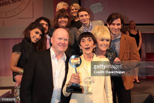 The cast of Eastenders including Steve McFadden and Barbara Windsor pose with the TV Soap Award in the press room at the TRIC Awards 2010 held at The...