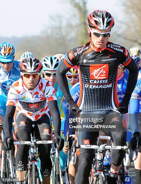 Polka dot jersey of best climber, Spanish cycling team Caisse d'Epargne's Spain's Alejandro Valverde rides with third placed of the stage, teammate,...