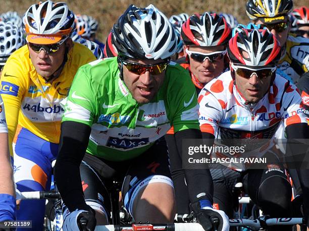 Yellow jersey of overall leader, Netherland's Rabobank cycling team's Netherland's Lars Boom rides with Green jersey of best sprinter, Danish Saxo...