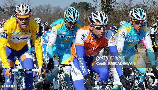 Yellow jersey of overall leader, Netherland's Rabobank cycling team's Netherland's Lars Boom rides in the pack with 2009 Tour de France winner,...